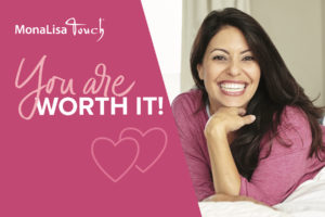 Woman with brown hair smiling widely on pink "MonaLisa Touch" ad
